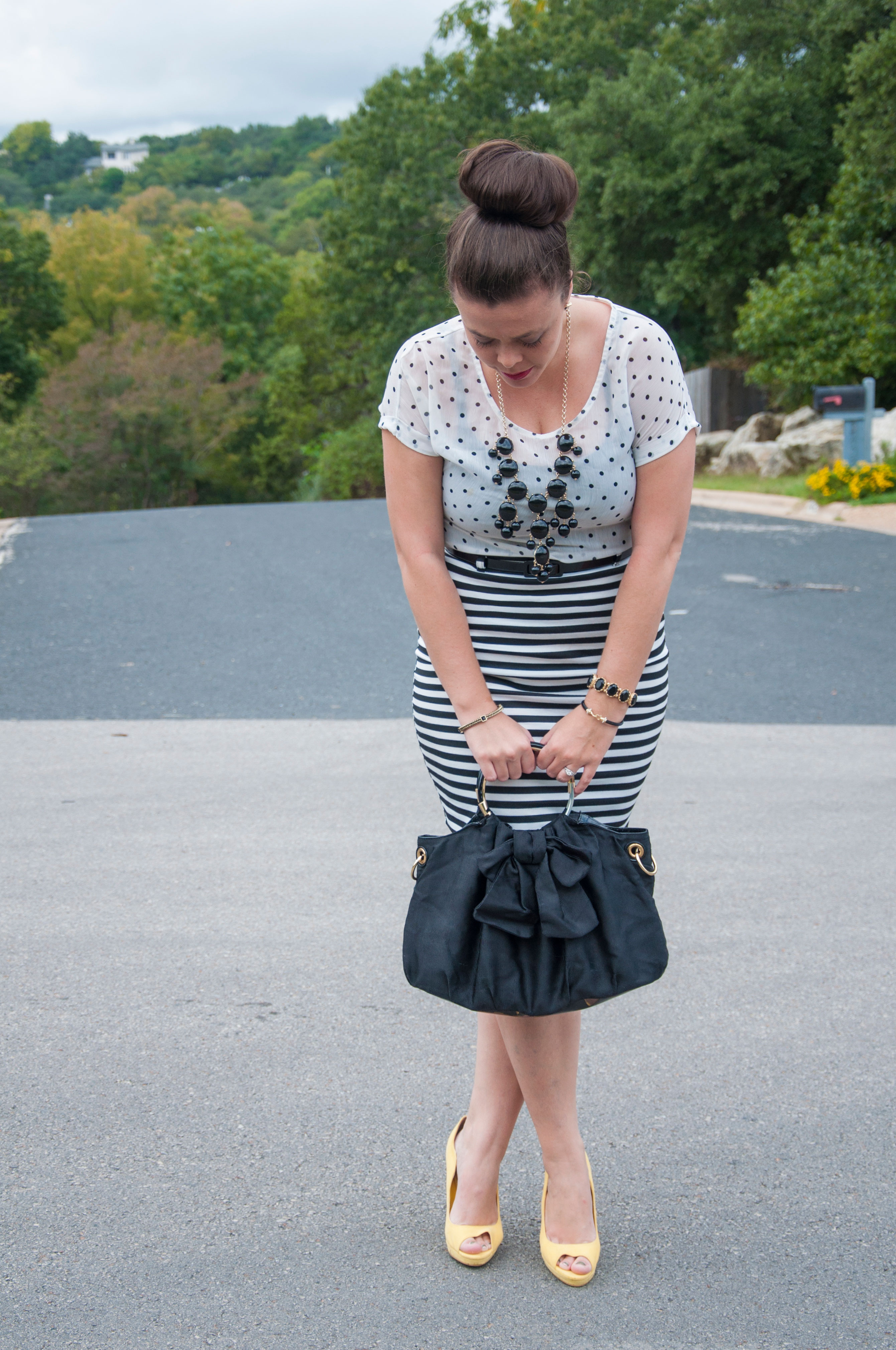 Combining a polka dot top with a white skirt