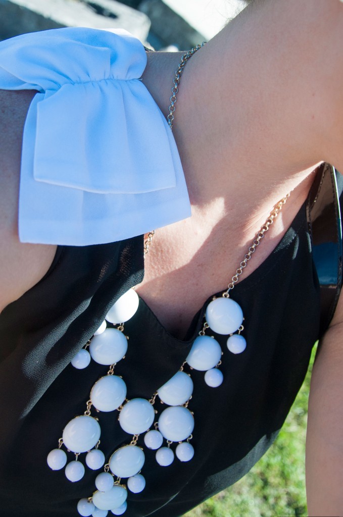 All That Glitters: White bubble necklace with bow top