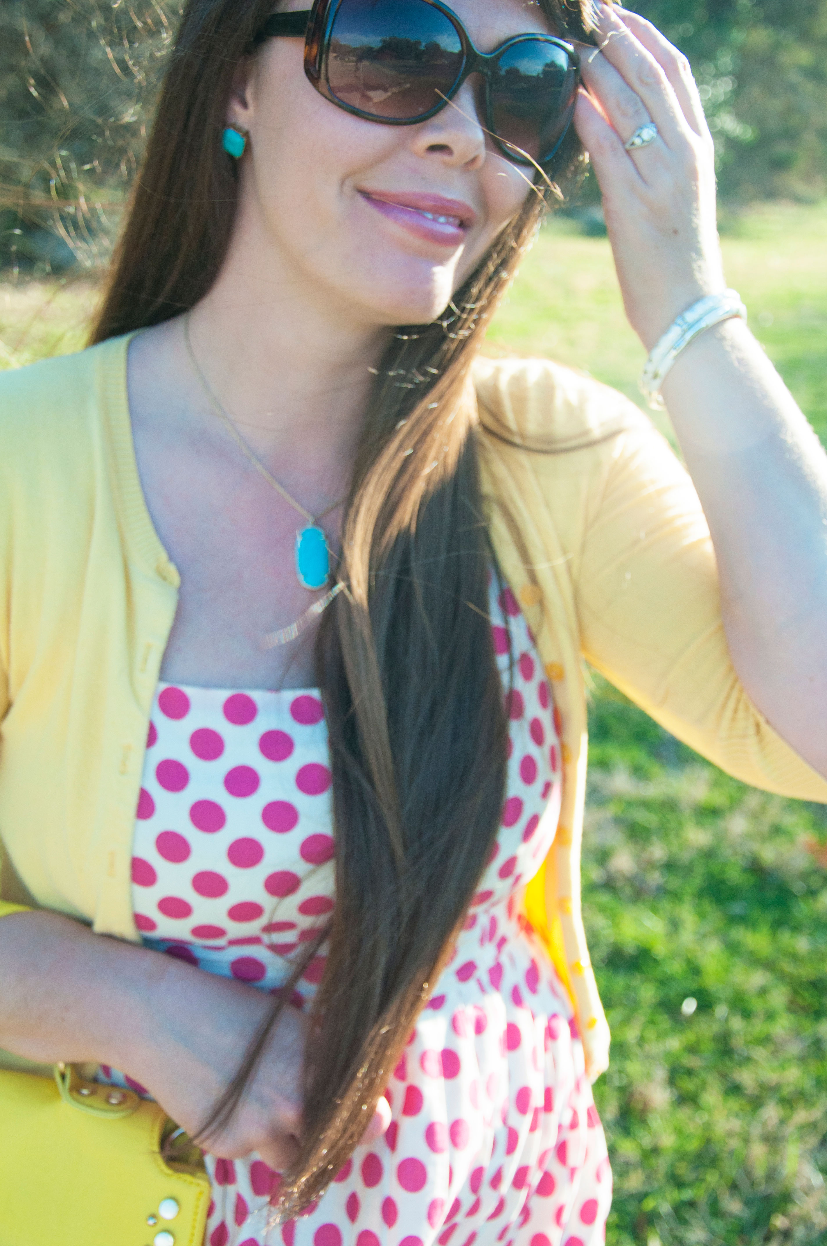 Pink and yellow outfit with turquoise pendant
