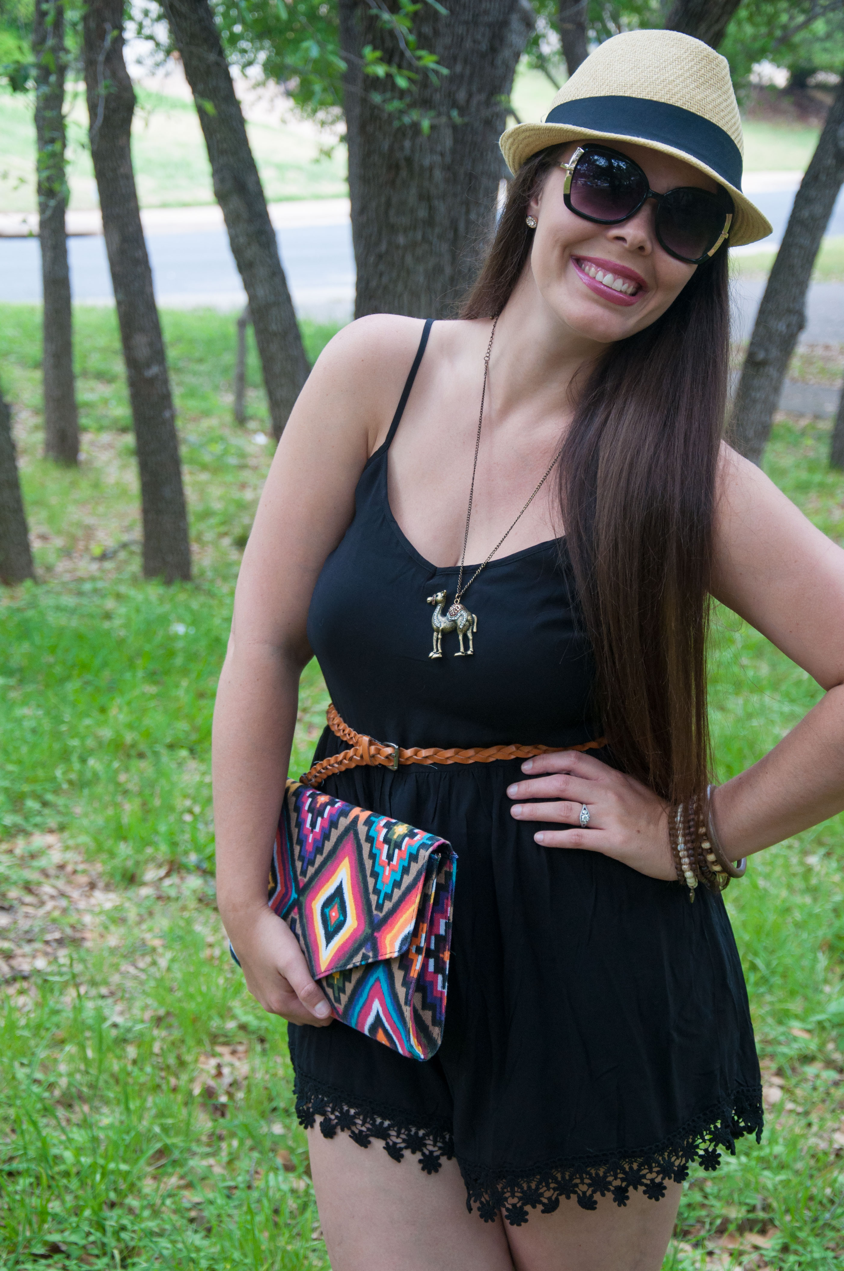 Black romper with colorful aztec clutch