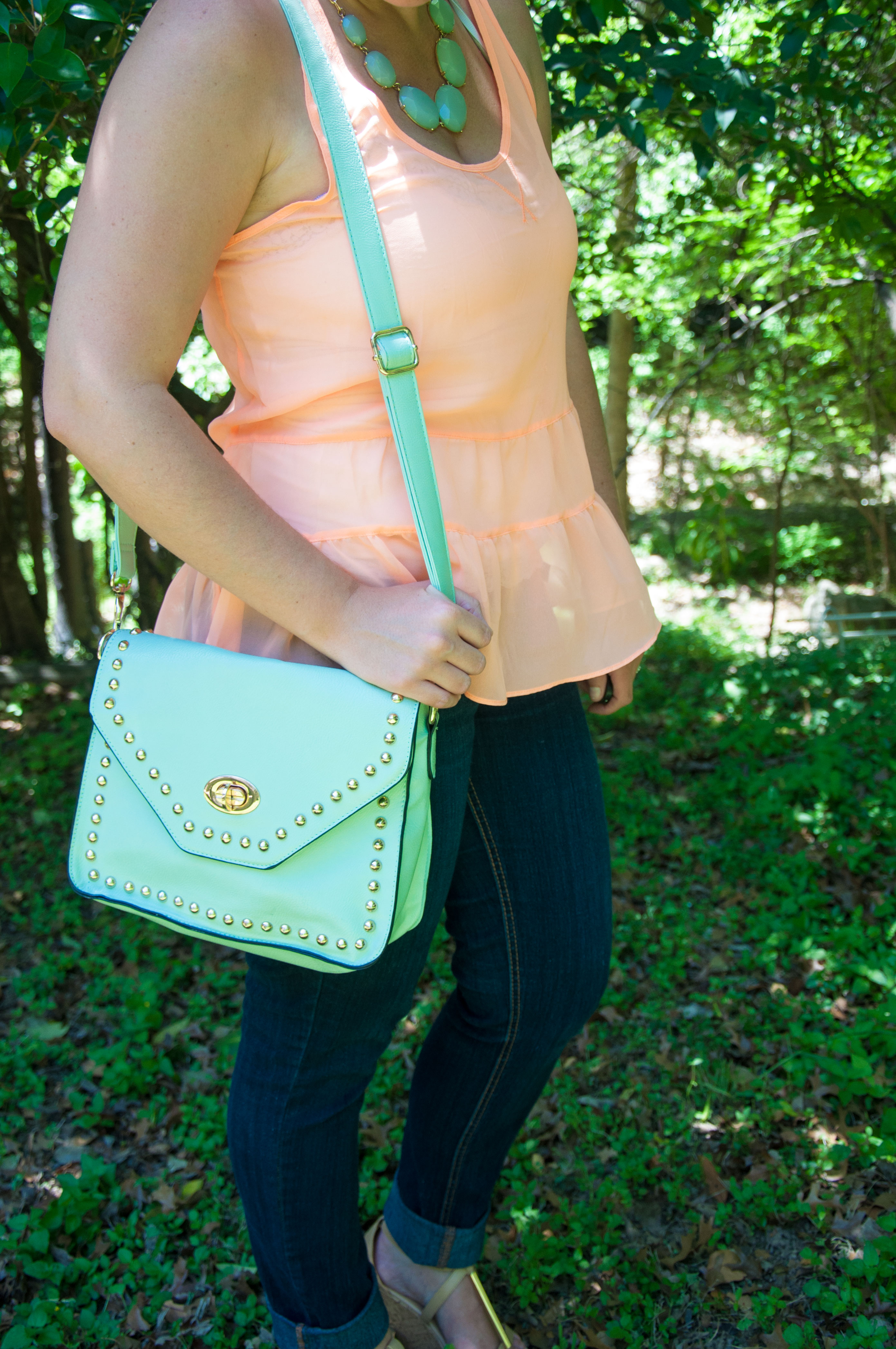 Peach ruffle top with mint accessories